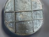 an image of a metal container with squares on it