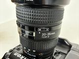 a camera with a lens attached to it ' s body