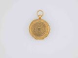a gold locke with a medallion on the front