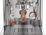 a close up of a coffee machine on a white background