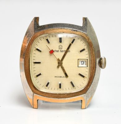 an image of a close up of a wrist watch on a white surface