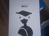 packaging of a wii game controller sitting on top of a cardboard box