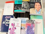 a lot of books that are on a table