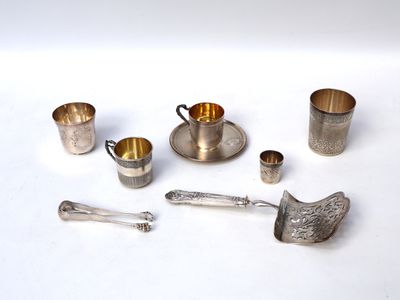 many different silverware items on a white surface