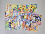a lot of cartoon books that are on the table