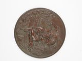 an image of a bronze medallion depicting a man and a woman