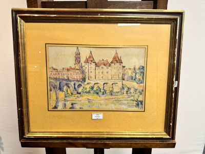 une photo d'une photo représentant un château, posée sur un chevalet