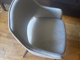 a chair that is sitting on a hard wood floor