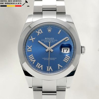 rolex day date watch with blue roman numeral dial