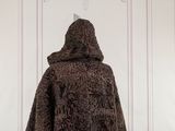 an image of a person wearing a fur coat
