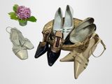 several pairs of women ' s shoes and a basket of flowers