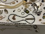 many different types of jewelry on the table