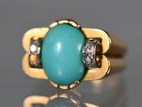 une image représentant une bague en or sertie d'une turquoise et de diamants