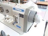 a sewing machine that is sitting on a table