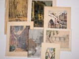 a lot of pictures hanging on the wall of a room