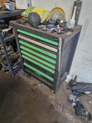 a workbench with tools on top of it in a garage
