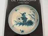 the cover of the book la faience de fribourg, with a picture of a bird on