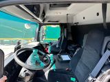 the interior of a van with a steering wheel and seat covers