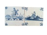 two blue and white tiles with windmills on them