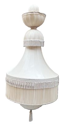 a white lamp that is hanging from the ceiling
