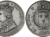 a close up of a coin with a crown on top of it