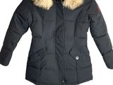 a close up of a jacket with a fur collar on a white background
