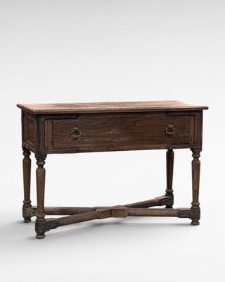an old wooden table with two drawers and a drawer underneath it