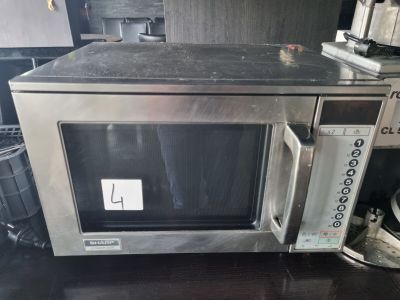 a microwave that is sitting on a counter in a kitchen