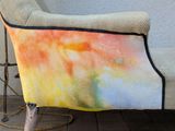 a chair that has a pillow on top of it