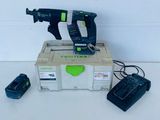 a couple of tools sitting on top of a box on top of a table