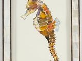 painting of a sea horse in a frame with a tag on it