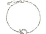 a diamond bracelet with a horseshoe charm on a chain