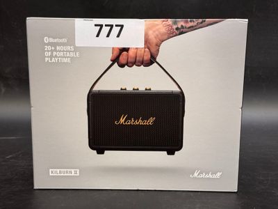 a box with a picture of a hand holding a speaker
