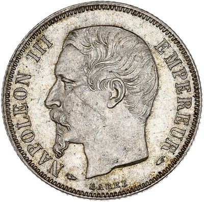a close up of a coin with a man ' s face on it