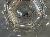 a close up of a clear glass object on a table