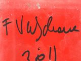 an image of a close up of a red plate with writing on it