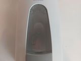 a white hand dryer on a white counter top