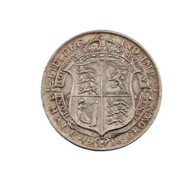 Gros plan sur une pièce de monnaie portant des armoiries