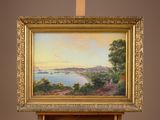 a picture of a painting hanging on a easel