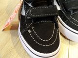 a close up of a pair of black and white shoes