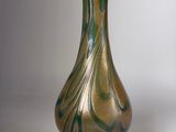 a glass vase that is sitting on a table