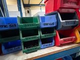 many bins on the shelf in the warehouse