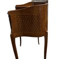 an image of a wooden chair with a carved back and legs