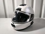 a helmet that is sitting on a white table