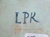 a picture of a close up of a plate with writing on it