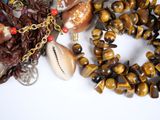 a necklace with a cowrie and a shell on it