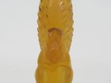 yellow glass figurine of a squirrel on a white background