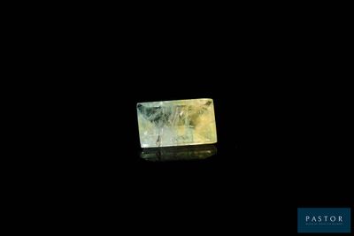 a close up of a piece of ice on a black surface