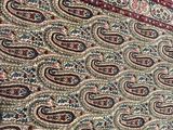 a cat that is sitting on a rug on the floor