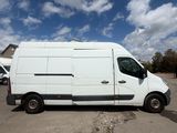 the white van is parked in a parking lot with other vehicles